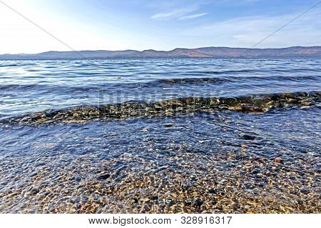 Clean Water In Lake Turgoyak On The Beach In Autumn, The Lake Is Also Called The Younger Brother Of 