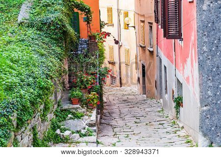 Croatia, Istria, Beautiful Old Cobbled Street And Traditional Houses In The Old Historical Town Of L