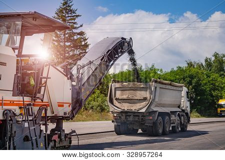 Road Repair, Highway Reconstraction. Heavy Special Machines. Feeder, Asphalt Paver And Pneumatic-tyr