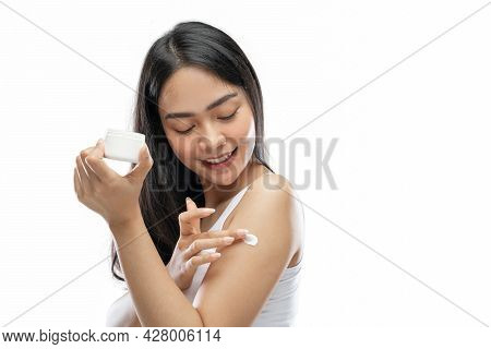 Asian Woman Wearing White Underdress Using Body Cream Rub Into Arm