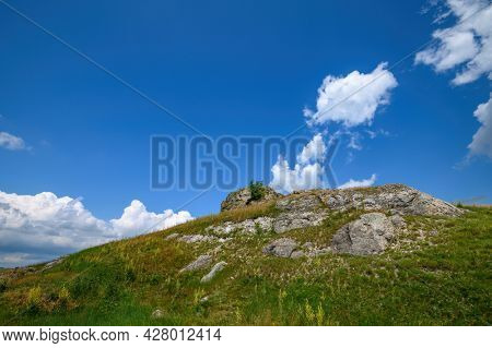 View to limestone toltres, rock residues of ancient coral reefs of dried Sarmatian sea at the North of Moldova