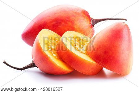 Ripe tamarillo fruits with tamarillo slices  isolated on a white background.