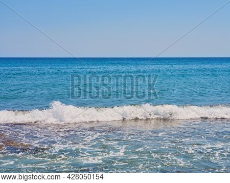 Waves With Foam On Aegean Sea Coast In Crete Greece