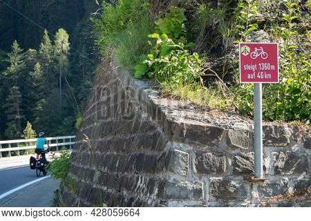 Until 1360m Rise To San Bernardino. A Cyclist Departs In Thusis, Switzerland