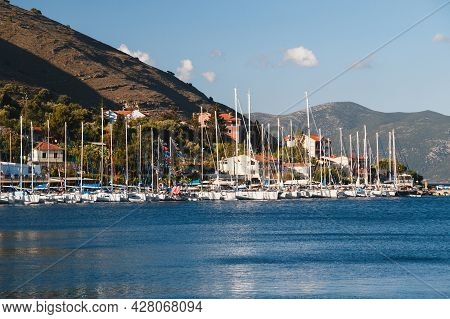 White Yachts Anchored In A Blue Bay Of Agia Efimia Port, Cephalonia Island, Greece.