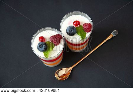 Panna Cotta With Raspberry, Italian Dessert Pana Cota With Berry Jam And Fresh Blueberries, Decorate