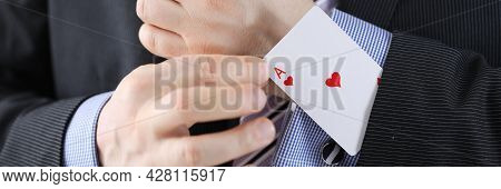 Businessman Pulling Ace Out Of His Jacket Pocket Closeup