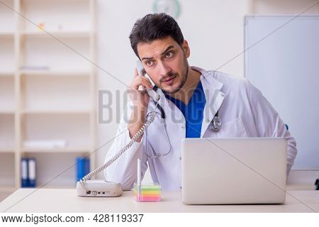 Young male doctor cardiologist in the classroom