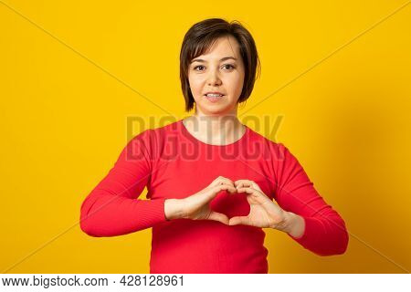 Be My Valnetine. Cute Young Woman Confesses In Love, Shows Heart Gesture, Smiles Broadly, Has Romant