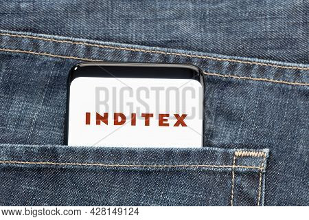Galicia, Spain, July 27, 2021: Smartphone In Pocket Jeans With Inditex Logo On Screen