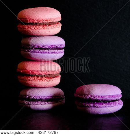 Macarons On Dark Background. French Pastry Makaron. Selective Focus