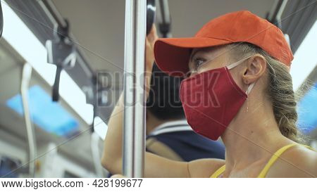 Woman Travel Caucasian Ride At Overground Train Airtrain With Wearing Protective Medical Mask. Girl 