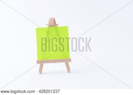 Wooden Easel Miniature With Blank Colored Square Canvas Or Memo Paper - Mockup. Mini Wooden Stand Wi