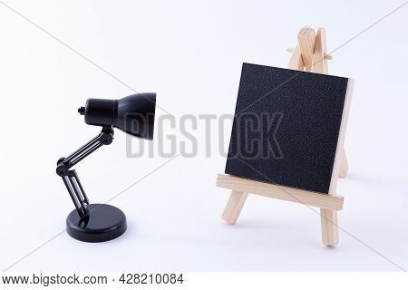 Wooden Easel Miniature With Blank Black Square Canvas For Artists And Painters - Mockup. Mini Wooden