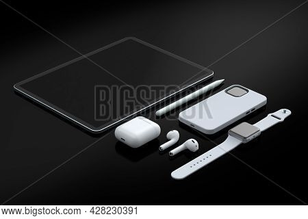 Computer Tablet With Stylus, Smart Watch, Phone And Headphones On Black.