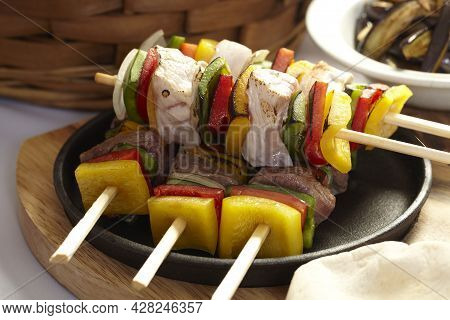 Food Cooked With Grilling Bbq Skewer On A Plate.