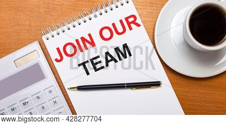 White Notebook With The Text Joi Our Team On The Table Next To Black Pencils On A Blue Background An