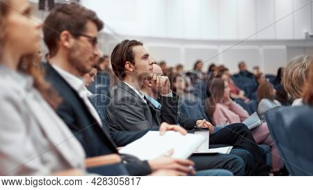 Young Business People Listening To A Lecture In The Conference Hall.