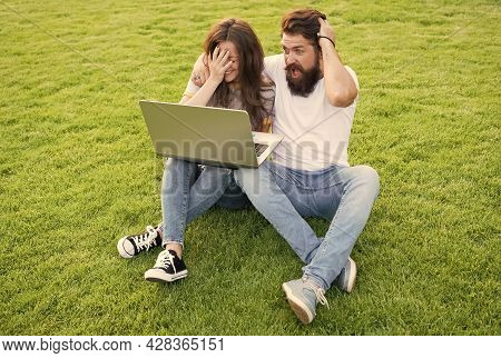 Cheerful Couple Use Laptop Sit Green Grass, Shocking Concent Concept