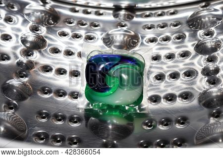 Gel Detergent For Washing Lies In The Drum Of The Washing Machine For Laundry. Laundry Concept, Remo
