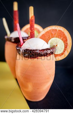 Refreshing Cantaritos With Tequila And Lime Snow, Accompanied By A Slice Of Orange, Lime And Mexican