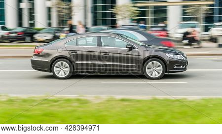 Moscow, Russia - May 2021: Volkswagen Passat Cc Facelift Car Moves On A Multi-lane Road. Modern Busi