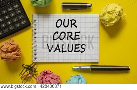 Our Core Values Symbol. White Note With Words 'our Core Values' On Beautiful Yellow Table, Colored P