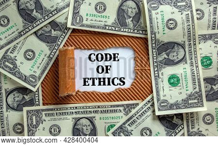 Code Of Ethics Symbol. Words 'code Of Ethics' Appearing Behind Torn Brown Paper. Beautiful Backgroun