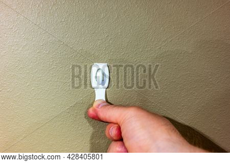 Selective Focus On Adhesive Strip Wall Hanger That Can Be Removed By Pulling Tape