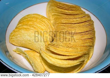 A Tasty Bowl Of Salty Pringles Potato Chips