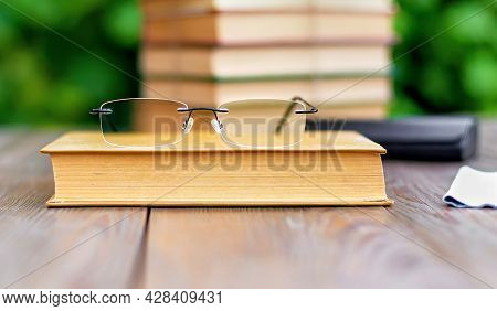 Transparent Glasses, Rimless Glasses In A Modern Style On A Wooden Table.