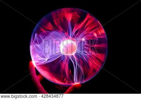 Hand Holding Plasma Ball Blue Violet Purple And Red