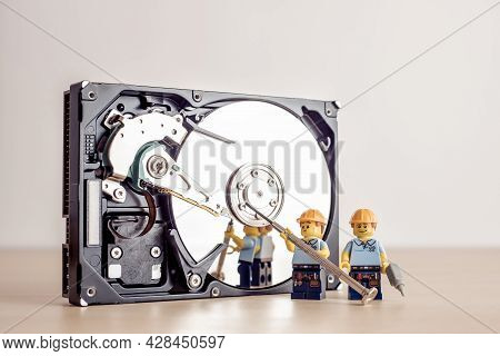 Billund, Denmark - July 15, 2021: Technicians Fixing Hdd Drive. Illustrative Editorial