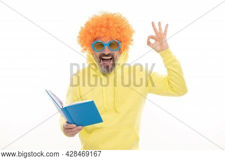 Happy Man In Funky Wig Show Ok Sign Gesture Reading School Book In Geek Sunglasses, Education