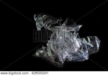 Plastic Foil From A Disposable Bag Shown Like A Horse Sculpture Against A Black Background, Packagin