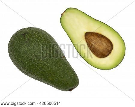 Avocado Divided Into Two Parts With The Stone, Pulp And Peel Isolated On A White Background.