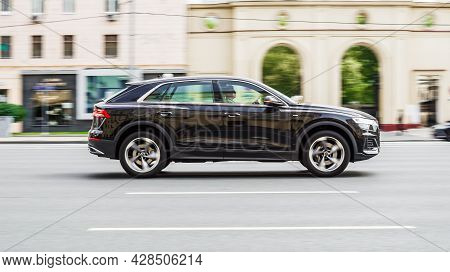 Moscow, Russia - August 2021: Audi Q8 Car Driving In City With Motion Blur, View From The Side