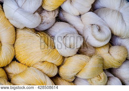 Bundle Of Raw White And Silk Thread Ready For Fabric Production