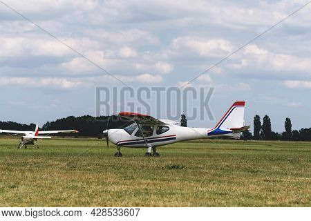 Planes On The Airfield Waiting To Go Into The Air. Conventionally Laid Out Single-engine, High-wing 