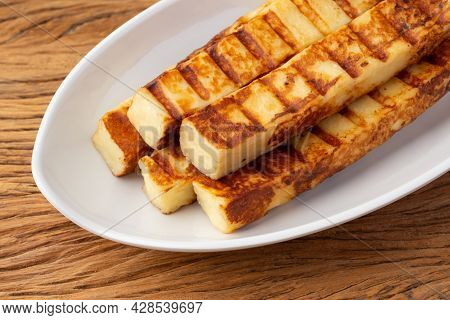 Grilled Rennet Or Coalho Cheese On A White Plate.