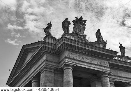 Details Of The Entablature With Statues Of Religious Saints On The Colonnades Of St. Peter's Basilic