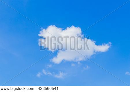 Little White Clouds Floating In The Sky Alone On A Clear Day Gives A Feeling Of Minimalism.