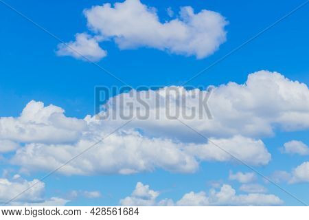 Many White Clouds Were Floating In The Sky During The Clear Summer Days.