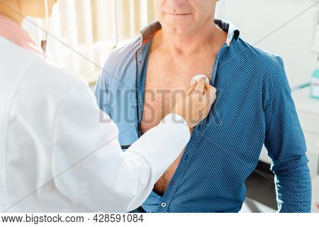 Doctor checking lung function of patient with stethoscope