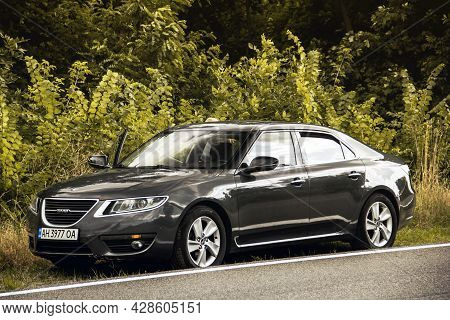 Chernigov, Ukraine - July 24, 2021: Saab Car On The Road. Gray Saab 9-5 2010 Car On The Background O