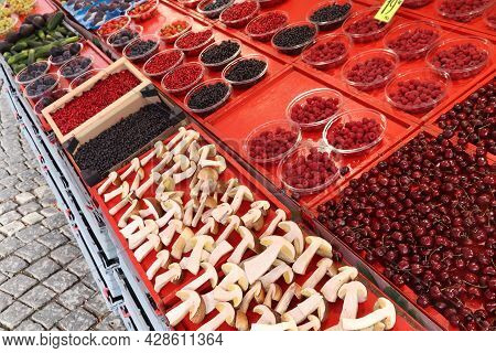 Food Market Of Hotorget In Stockholm, Sweden. Bolete Mushrooms From The Forest, Wild Berries, Lingon