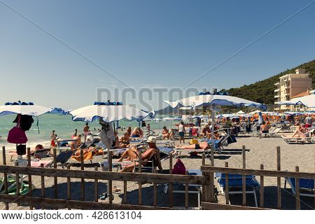 Ceriale, Ligurian Sea, Italy - 12 July 2021: Tourists Flock To Italian Beaches. The Bathing Establis