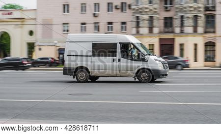 Ford Transit Third Generation In The City Street. Side View Of White Panel Van, Light Commercial Veh