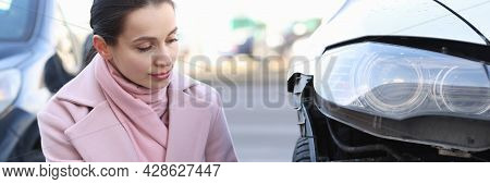 Insurance Agent Holds Estimate Of The Value Of Damaged Vehicle