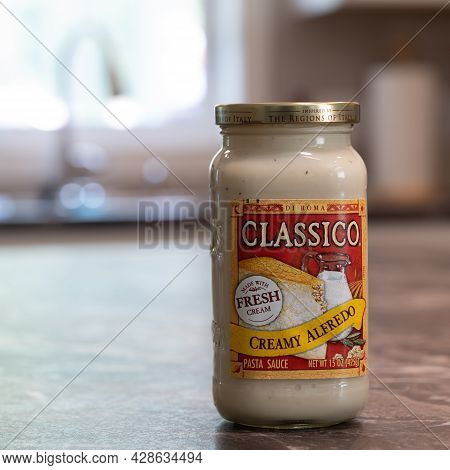 Nisswa, Mn - 2 Aug 2021: Jar Of Classico Brand Of Creamy Alfredo Pasta Sauce On Kitchen Counter. Mad